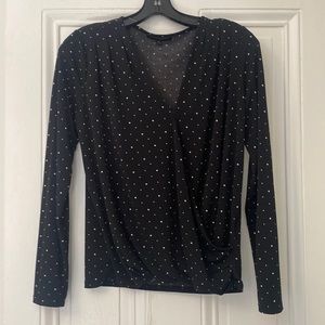 One sleeve faux wrap black polka dot top